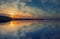 Beautiful clouds and colorful water in lake reflected in evening