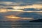 Beautiful clouds and orange sunset over the sea