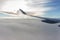 Beautiful cloudscape from airplane window, Qatar Airways. Airplane wing and aerial view of scenic morning sky. Flight concept.