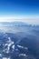 Beautiful cloudscape and snow mountains from plane window