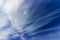 Beautiful cloudscape with sunlight and cirrus clouds on blue sky.