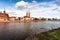 Beautiful cloudy cityscape of Wroclaw Ostrow Tumski square with cathedrals and old tenement