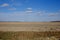 Beautiful cloudy sky over farmland. Spring landscape