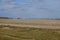 Beautiful cloudy sky over farmland. Spring landscape