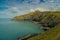 Beautiful coastline of grassy cliffs and calm sea