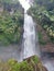 The beautiful Coban Talun waterfall located in Batu City, East Java in the photo at noon