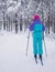 Beautiful cold forest view of ski run track on ski resort, winter day on a slope, pist, nordic skier on the track in winter,