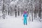 Beautiful cold forest view of ski run track on ski resort, winter day on a slope, pist, nordic skier on the track in winter,