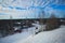 Beautiful cold mountain view of ski resort, sunny winter day with slope
