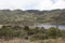Beautiful colombian chuza reservoir lake panorama on sunny day with mountains