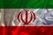 Beautiful colored national flag of state of Iran on fabric canvas, burlap, closeup, concept of tourism, economy and politics