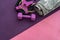 beautiful colored pancakes for bars protein dumbbells arranged on a pink mat.