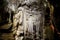 Beautiful colorful and illuminated cave with stalactites and stalagmites