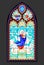 Beautiful colorful medieval stained glass window. Gothic architectural style. Image of angels and Madonna and Child. Architecture
