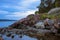 Beautiful colorful Norwegian landscape with rocky coast and blue sky