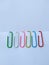 Beautiful colorful paper clip on white background