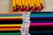 Beautiful and colorful pencil crayons. Bright wooden table.