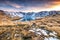 Beautiful colorful sunrise with view on snowy mountain range reflected in Angelus Lakes near Angelus Hut