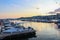 Beautiful colorful sunset in the harbor of city of Drama, Greece with boats