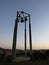 Beautiful Colorful Sunset Over Silhouette of Bell Tower with Cross and Four Bells