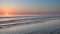 Beautiful colorful vibrant sunrise over low tide beach landscape