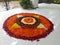 Beautiful colourful flower rangoli on white tiles in the varandha during harvest festival onam in keral,south india