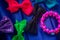 Beautiful and colourful hair clips, bracelet for kids and teens on a blue background