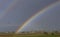 Beautiful complete rainbow over the countryside of the province of Pisa, Tuscany, Italy