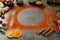 Beautiful composition with different spices, silhouettes of cutlery and plate on grey table