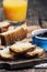 Beautiful composition of Manhego cheese - fresh homemade sourdough bread and hand-squeezed orange juice - Concept