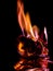 Beautiful concept flames. Fire on burns paper with black background.