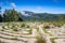 Beautiful concrete path maze at the edge of a mountain overlooking another with clouds drifting