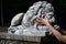 Beautiful concrete sculpture of a lion grey women