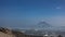 A beautiful conical volcano on a blue sky background.