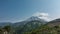 A beautiful conical volcano on a blue sky background.