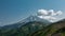 A beautiful conical volcano with snow-covered slopes