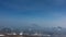 A beautiful conical volcano with snow-covered slopes against a blue sky background.