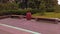 A beautiful corner in the city Park with two granite benches and a large urn against the background of greenery on a clear day