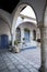 Beautiful corner of doorway and windows with arch and plants St. Lazarus church