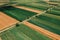 Beautiful countryside patchwork pattern of cultivated landscape from drone pov