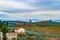 Beautiful countryside view in Tuscany, Italy. Farm landscape with grape vine rows and olive trees grove. Autumn in Italy