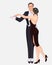 Beautiful couple in art deco style dancing tango. Retro fashion: glamour man and woman of twenties. Vector illustration. Flapper