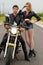 Beautiful couple bikers motorcyclists on the road