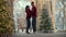Beautiful couple dances by the Christmas tree