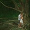 Beautiful couple in dramatic forest