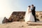 Beautiful couple. gorgeous bride in wedding dress posing with elegant groom on sea cost