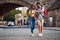 Beautiful couple in love walking outdoors at the city street.Travel, tourism and people concept