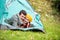 Beautiful couple lying in tent, camping in autumn nature