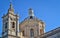 The beautiful couple of old St. Paul`s Church with bells and so many details in rabat, malta on a sunny day