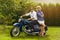 Beautiful couple on retro motorbike